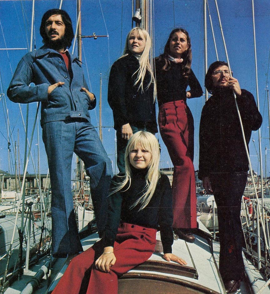 Models posing on a boat wearing Le Glazik outfits in the 1970s