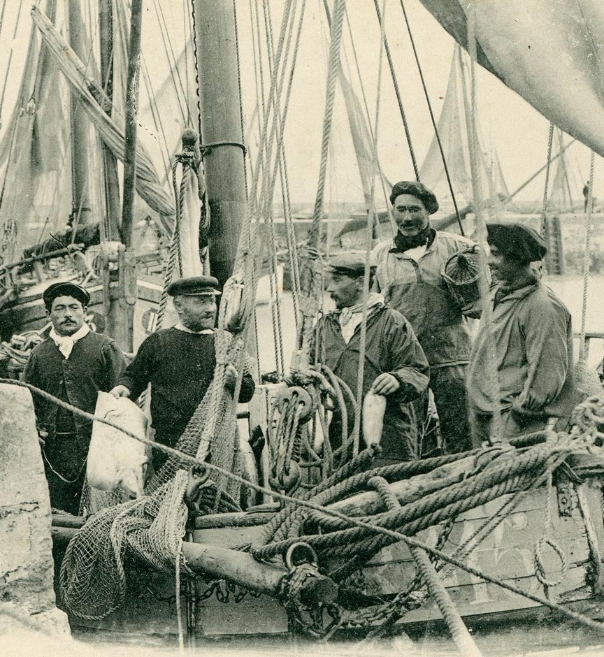 Archive photo of Breton fishermen wearing Le Glazik smocks on a fishing boat